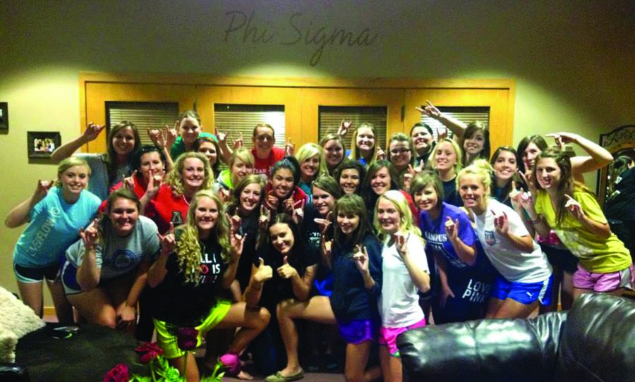 Some of the members of Alpha Omicron Pi come together in their sorority houses lounge to hang out. These girls are forever bound by their pledges to become members of AOII and sisters to each other.
Photo Courtesy of Jacobi Goodell