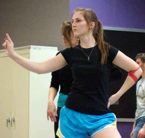 Makenzie Hinrichs, a sophomore theatre and business major, prepares for the dance concert It’s Essential March 7-8.  She creates a new movement for the piece during dance rehearsal.
Photo by Suneun Yoo