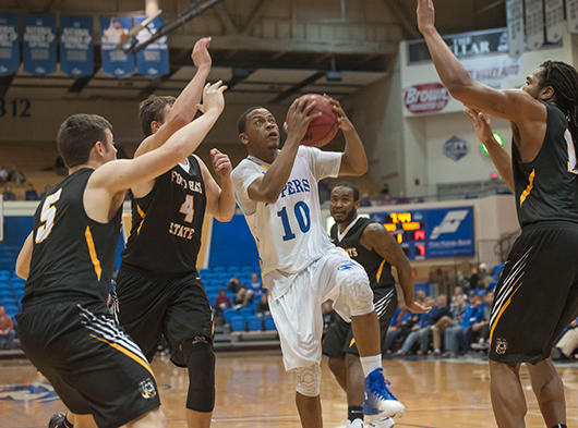 Junior guard Yashua Trent splits three defenders on his way to score during the Lopers’ game against rival Ft. Hays State on Jan. 12. UNK defeated Ft. Hays 86-89. The Lopers are currently 12-6 (5-4 in the MIAA) and will play at home again on Thursday Jan. 26 at 7:30 against Lindenwood University (14-8, 4-6).