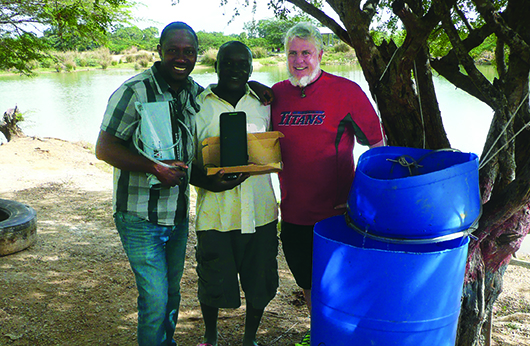 Courtesy Bickford, right, with local pastor in charge of one of the programs sites (middle) and a man named Threese, (left) who oversees another site and started one school currently under construction by university’s program.