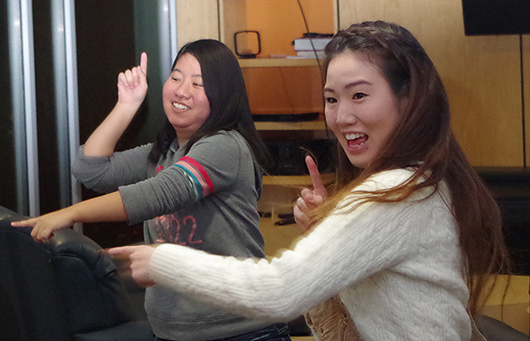 Photo by Sydney Norris Junior musical theatre major from Osaka, Japan, Akira Watanabe (right) practices with other students one dance for the festival. Laughter and excitement fills the room while the students show off their hard work and prepare for the big night.  