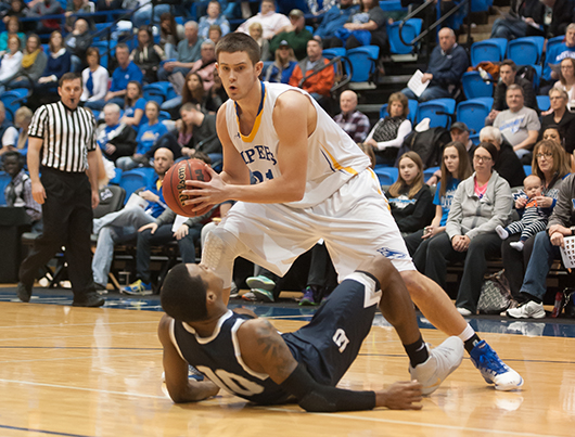 Junior forward Trey Lansman looks to pass over Lincoln's Jaylon Smith. Lansman, who played all 40 minutes of the game, made 12 of 15 field goals, including 3 of 4 three pointers to lead the Lopers in scoring with 30 points. Lansman also had seven rebounds and three assists.