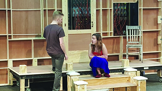 Brenden Zwiebe, a sophomore theatre major from Lincoln, confronts freshman theatre major Megan Hayhurst, Scottsbluff, during a front porch scene. Zwiebel plays Jake, an abusive plantation worker, while Hayhurst plays Flora, his battered wife.