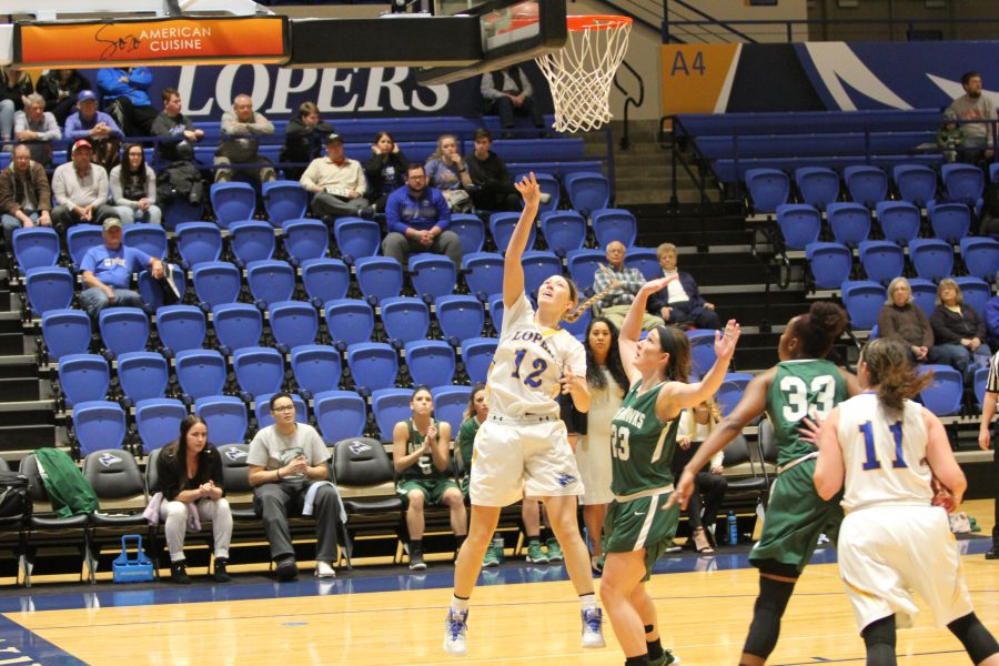 Alyssa+Frauender%2C+grad+student+from+Humphrey%2C+NE%2C+goes+for+the+layup+against+the+Riverhawks.+The+team+finished+the+half+with+a+18-3+run+including+Michaela+Barry%2C+Adreon+Bell+and+Alyssa+Frauender.