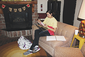 Kaitlyn Thomas, a senior business administration and finance major from Yuton, studies while sitting on one of the many comfortable seats located in Chapman Swifts Coffee House Thursday night. 
