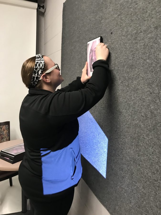 UNK senior Hannah Keen installs one of her final projects to prepare for graduation. Keen’s future goals include moving to the coast to attend graduate school and becoming a marine biologist.