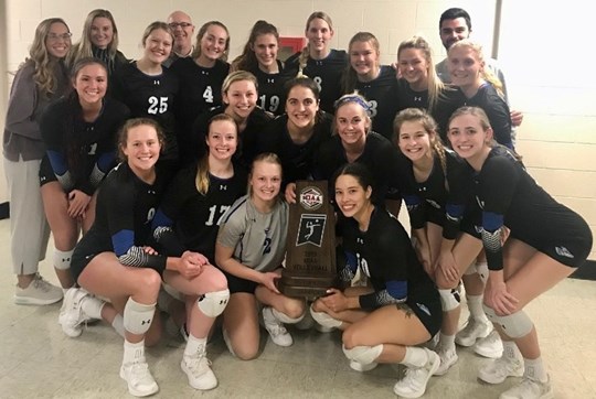 UNK womens volleybal team poses with their regular season conference championsip trophy after their Nov. 9 game at Missouri Western State.