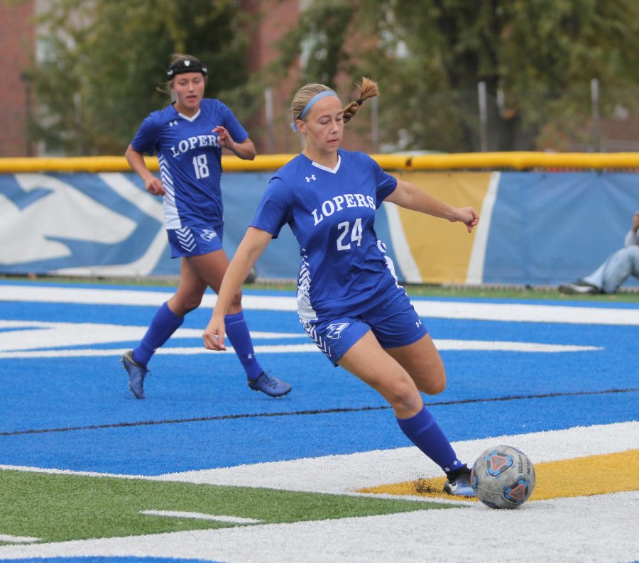 unk soccer player kicking the ball