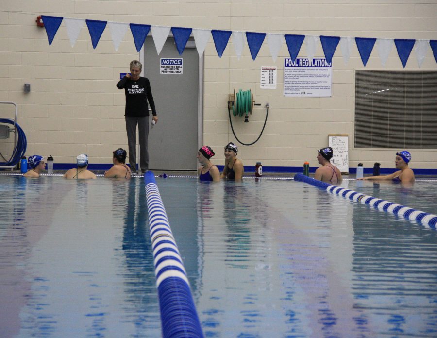 Coach+Becky+O%E2%80%99Connell+instructs+her+swimmers+to+do+warmups+during+swim+practice.