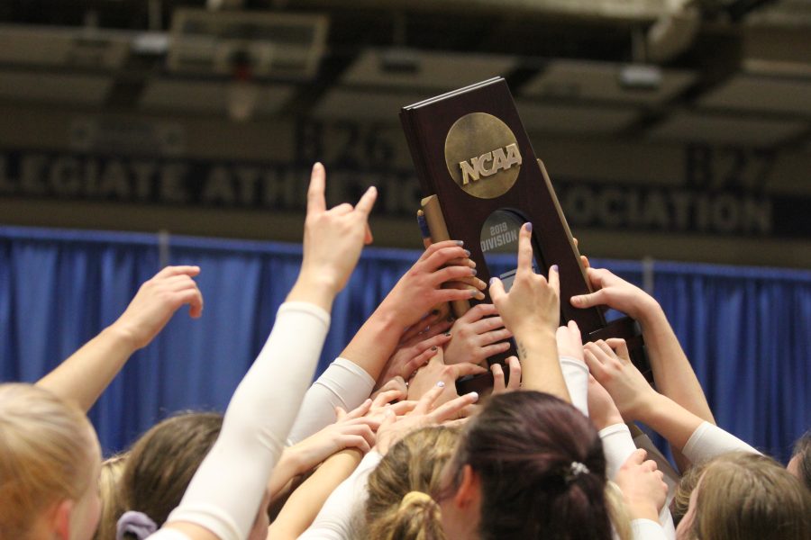 Loper+volleyball+holding+up+the+regional+trophy