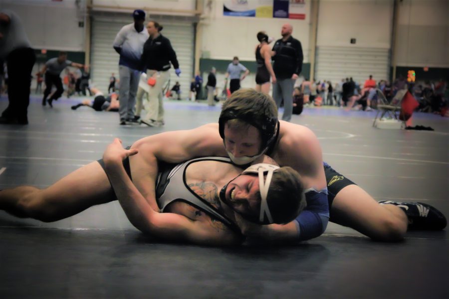 Sam Turner looks to get a pin against his opponent in a dual with Western Colorado.