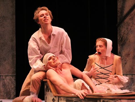 Sade (Max Wohler) tormented the patient playing Jean Paul Marat (Hunter Scow), debating the politics of revolution in front of Marat’s companion Simonne (Darian Wilson).