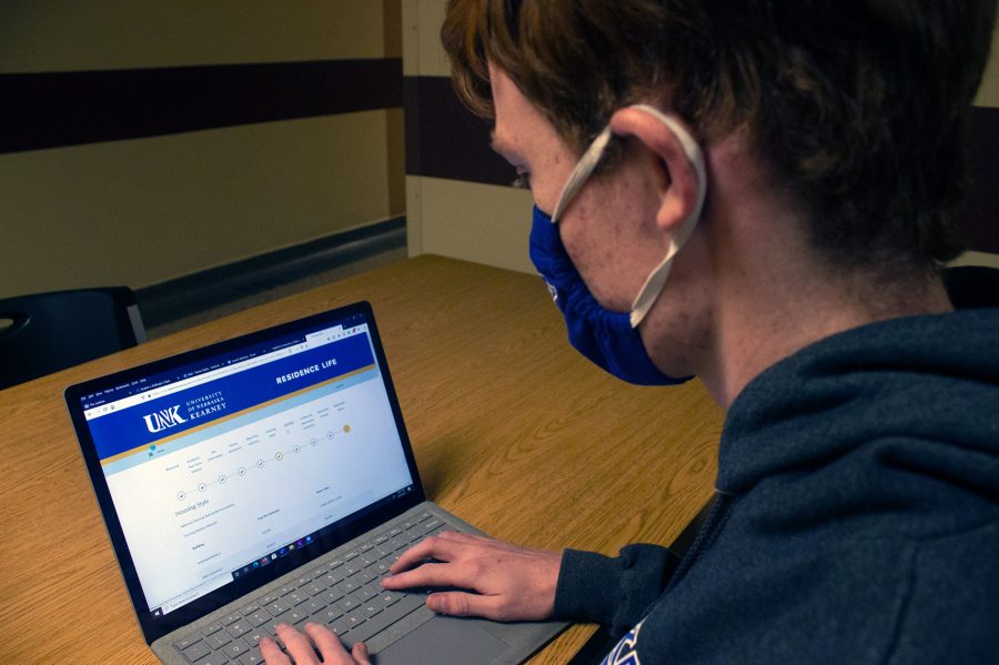Tanner Butler fills out his housing contract using the Residence Life portal available on MyBlue.