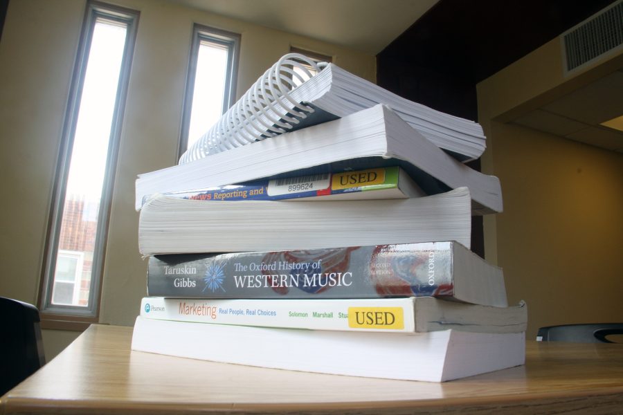 Textbooks can now be condensed into a cell phone, making students reevaluate their use.