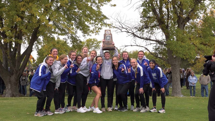 Women’s cross country celebrated their first MIAA championship win after their meet at the Kearney Country Club.