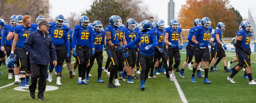 Loper+football+runs+onto+the+field+in+a+previous+game+against+Northeastern+State