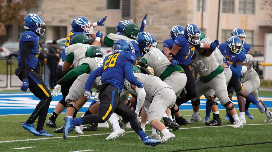 The+Lopers+try+to+block+an+extra+point+in+their+win+against+Northeastern+State.+It+was+the+only+touchdown+the+Lopers+gave+up+in+the+game.