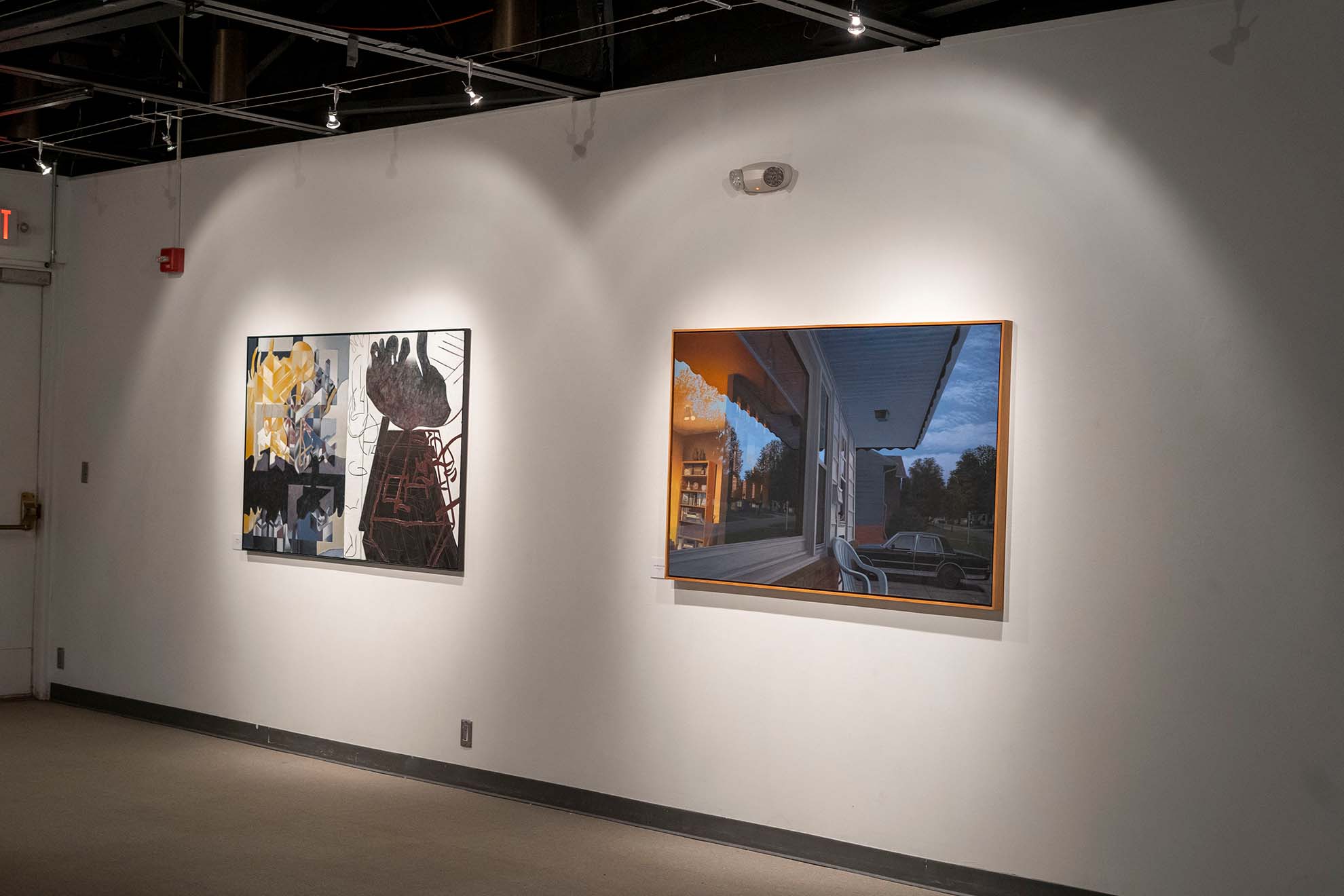 The exhibition features both abstract and realistic paintings.