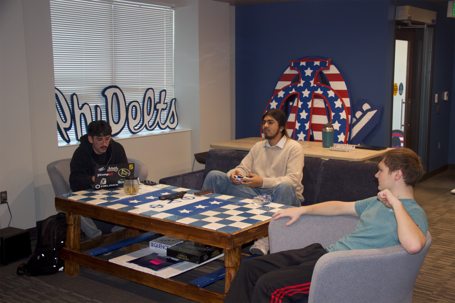 Phi Delta Theta members hang out in their new chapter room. Photo by Grace McDonald / Antelope Staff