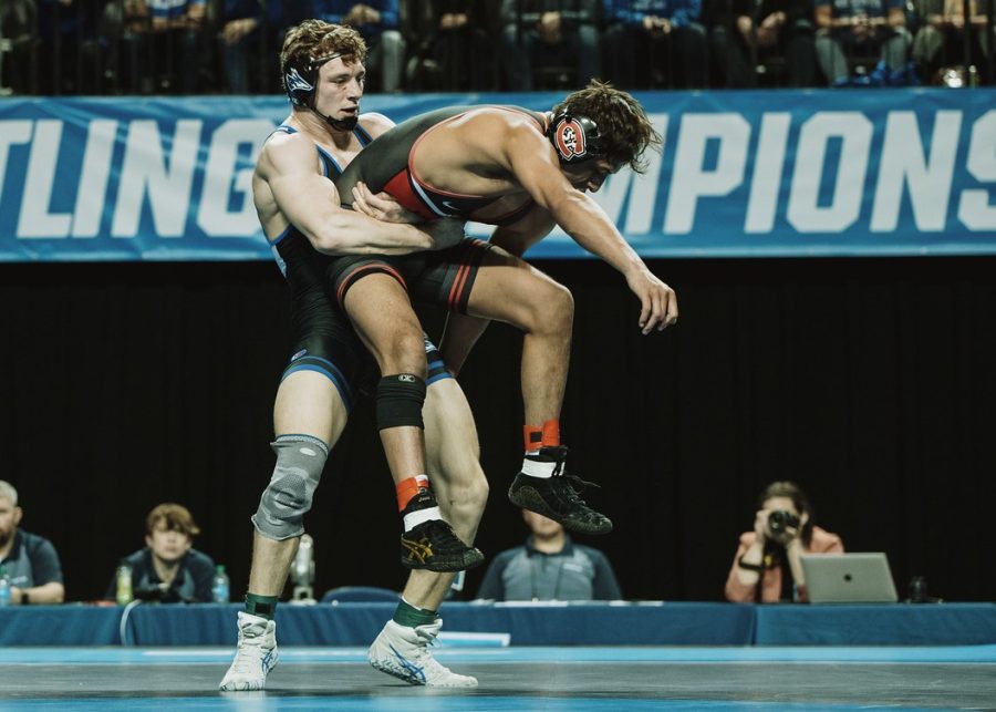 Austin Eldredge picks up Abner Romero of St. Cloud State in the championship match. - Photo by Zach Lefebure