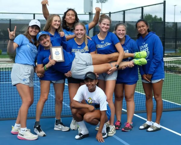 The UNK womens tennis team holds up Jazmin Zamorano after her finals win Sunday. Courtesy Photo