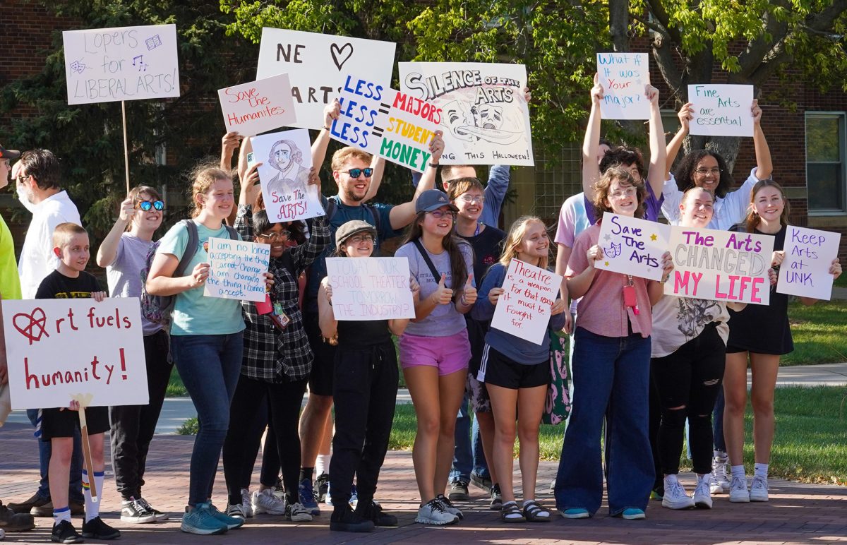 Students, faculty and staff gather around Cope Fountain to protest proposed budget cuts. Photo by Shelby Berglund / Antelope Staff