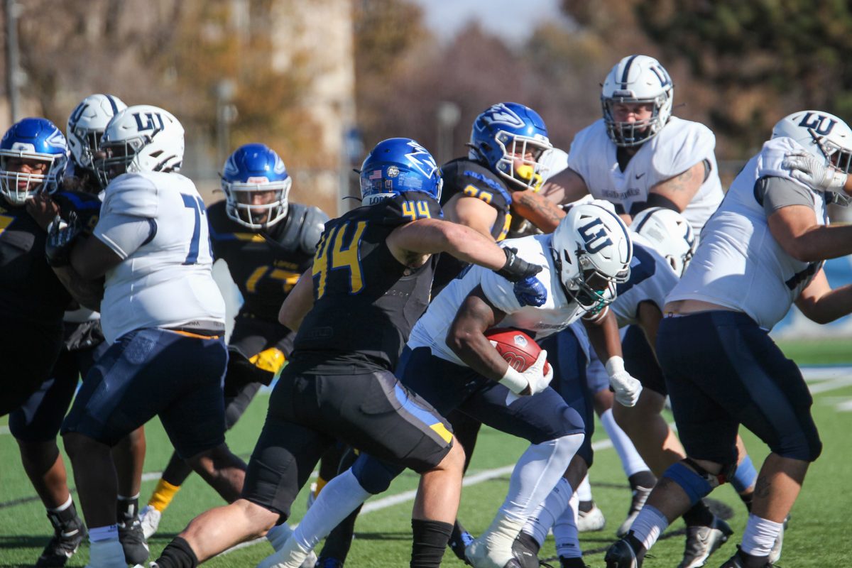 UNK+linebacker+Parker+Wise+winds+up+to+try+and+knock+the+ball+loose+from+a+Lincoln+player+during+the+Lopers+38-6+win.+Photo+by+Traeton+Harimon+%2F+Antelope+Staff