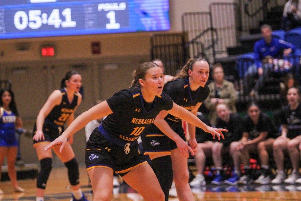 UNKs Halle Duft and Shiloh McCool get set on defense during the Lopers 85-57 loss to Pittsburg State Saturday.