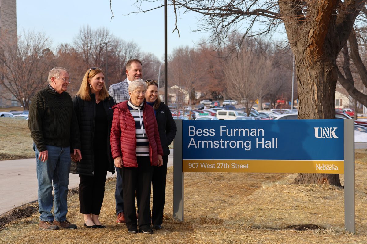 Diana+Armstrong+and+family+stand+by+the+new+dorm+sign.+Photo+by+Jenna+Heinz+%2F+Antelope+Staff