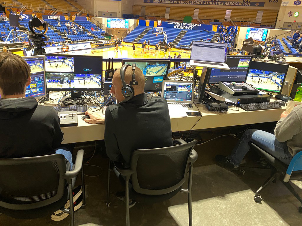 Jeff Babl, center, and his team run a LoperVision broadcast at a UNK basketball game. Babl helps run the replay system for football, basketball and now adds softball to the list. Photo by Traeton Harimon / Antelope Staff