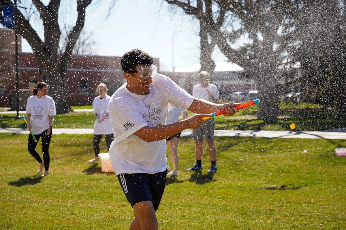 Students fling powder and water balloons for Holi Festival of Colors. Photo by Shelby Berglund / Antelope Staff