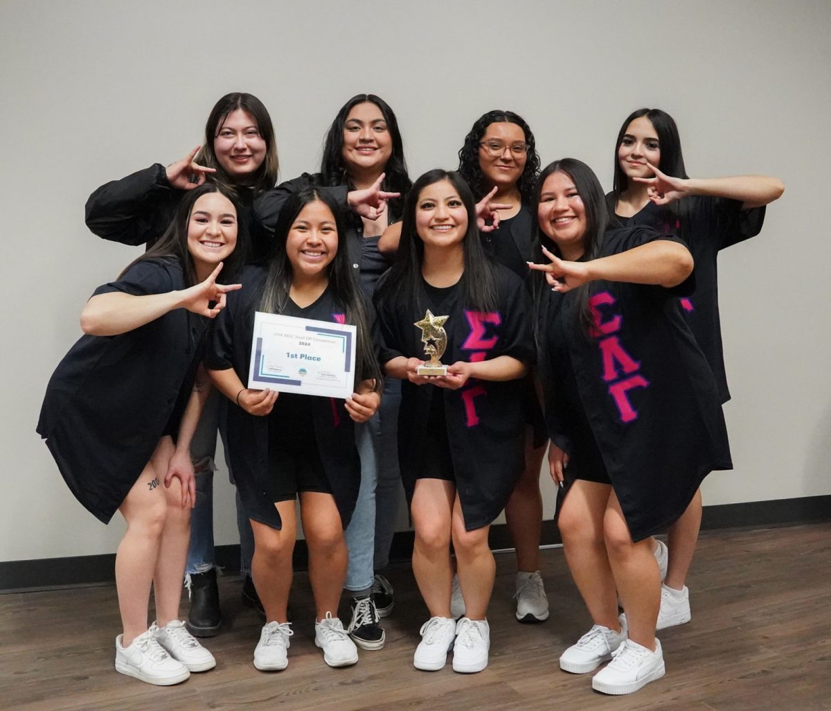 Sigma Lambda Gamma National Sorority, Inc. pose with their trophy. Photo by Shelby Berglund / Antelope Staff