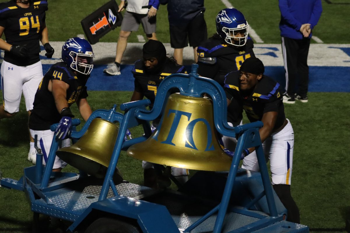 UNK brought back the victory bell for its first public appearance since 2016, as it is used to celebrate a Loper win. Photo by Gabby Roche / Antelope Staff