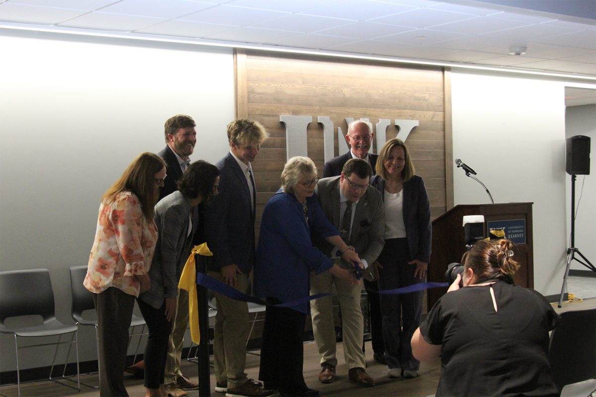 Janet Hike, former dean of the library, and Evan Boyd, dean of the library, did the honors of cutting the ribbon. Photo by Jenju Peters / Antelope Staff