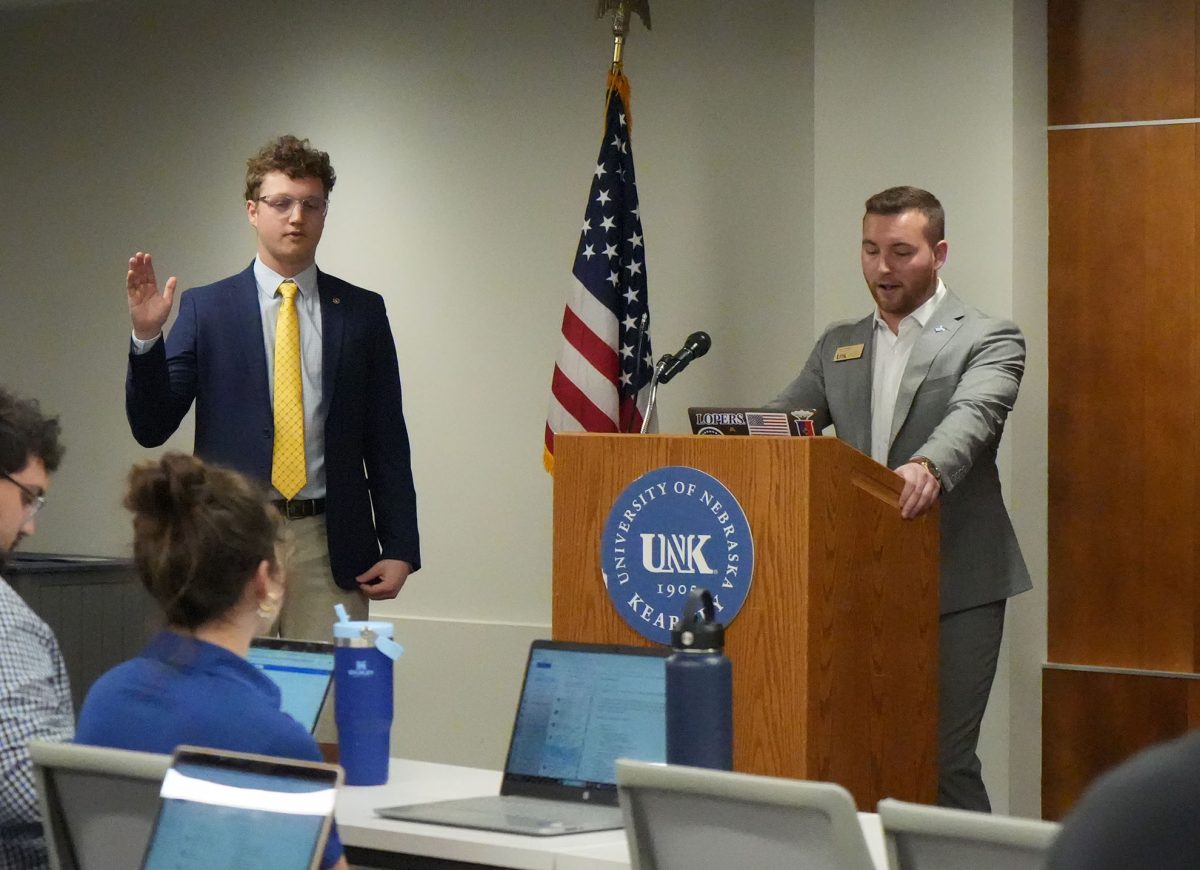 Luke Przymus swears Brendan Sloup into the Senate. Photo by Jenju Peters / Antelope Staff